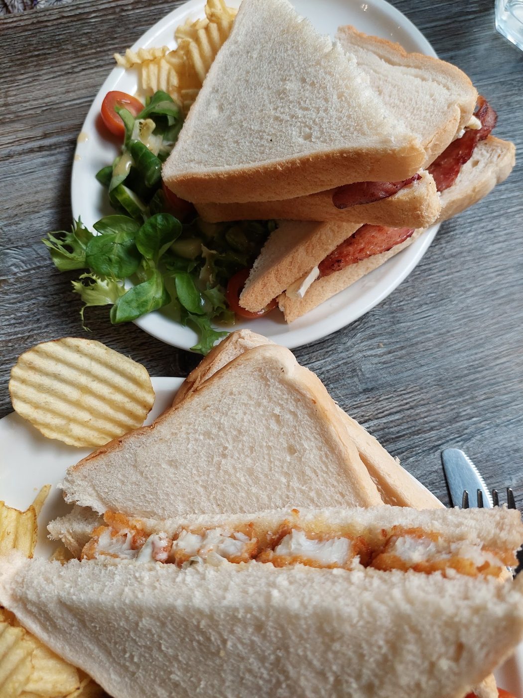 Toasted sandwiches with crisps and salad